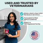 A woman in blue medical scrubs holding a can of KOHA pet food. The copy says Used and Trusted by Veterinarians. There are three bullet points that say: KOHA is sold in over 5,000 pet stores and vet clinics, formulated to meet AAFCO guidelines, and Made in an FDA registered facility. There is a graphic representing the American Flag that says Made in the USA.
