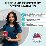 A woman in blue medical scrubs holding a can of KOHA pet food. The copy says Used and Trusted by Veterinarians. There are three bullet points that say: KOHA is sold in over 5,000 pet stores and vet clinics, formulated to meet AAFCO guidelines, and Made in an FDA registered facility. There is a graphic representing the American Flag that says Made in the USA.
