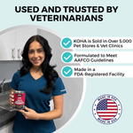 A woman in blue medical scrubs holding a can of KOHA pet food. The copy says Used and Trusted by Veterinarians. There are three bullet points that say: KOHA is sold in over 5,000 pet stores and vet clinics, formulated to meet AAFCO guidelines, and Made in an FDA registered facility. There is a graphic representing the American Flag that says Made in the USA.
